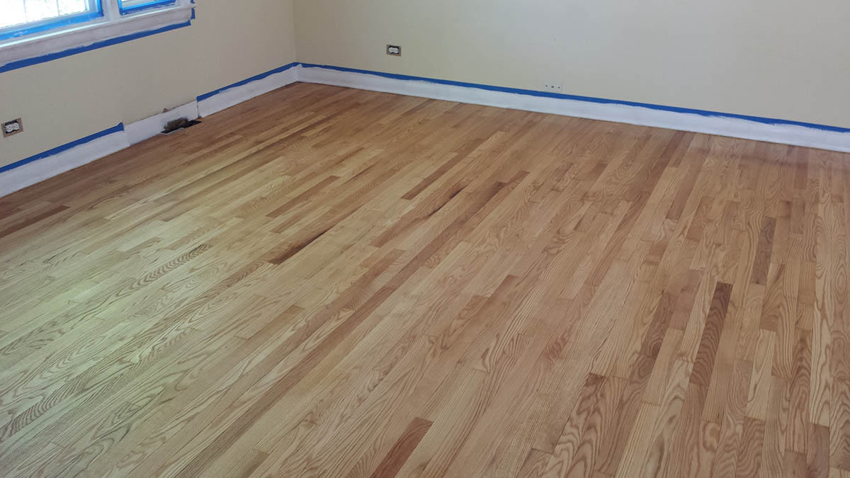 Natural stain oak hardwood floor after professional refinishing in Highland Park, IL by Midwest Hardwood Floors