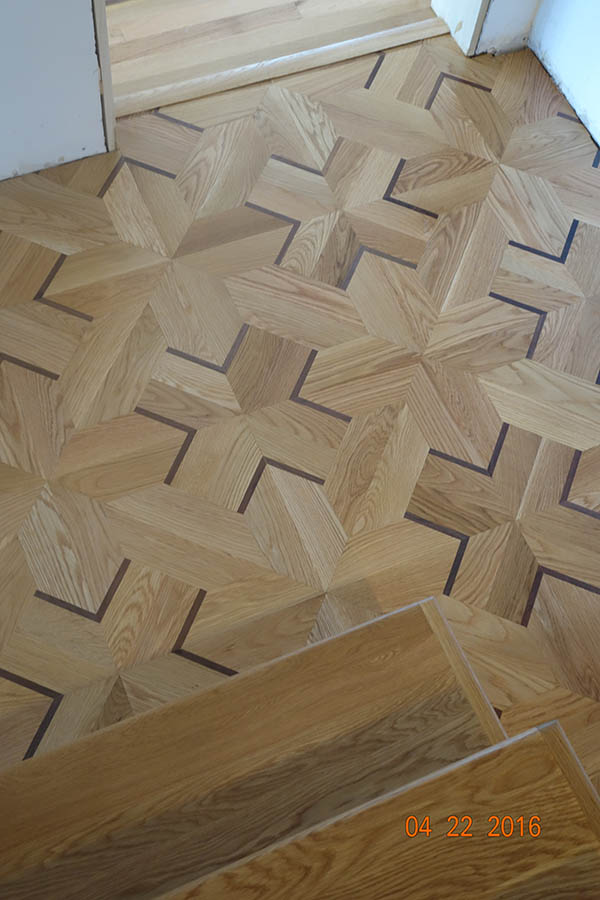 Custom white oak stairs with white oak and Wenge hardwood floor pattern in Chicago, IL by Midwest Hardwood Floors