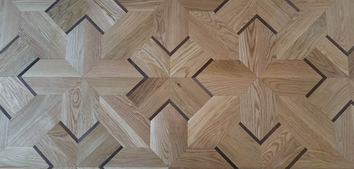 Custom white oak geometric hardwood floor pattern with Wenge inlays in Chicago, IL by Midwest Hardwood Floors