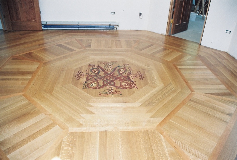 Custom hardwood floor medallion with geometric wood pattern in a Chicago home