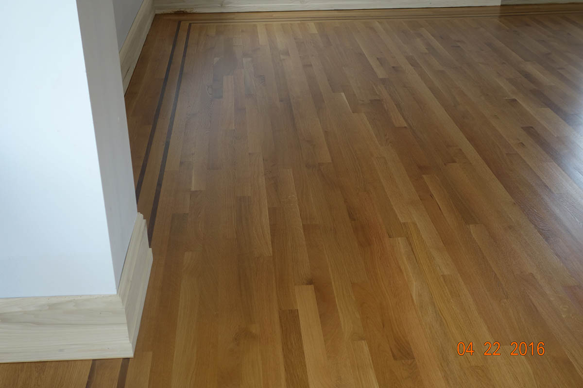 White oak hardwood flooring with double Wenge border inlay in Chicago, IL by Midwest Hardwood Floors