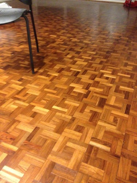 Teak parquet hardwood floor being professionally sanded in Wilmette, IL by Midwest Hardwood Floors