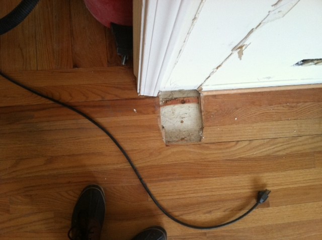 Damaged hardwood flooring area prepared for repair in Chicago, IL by Midwest Hardwood Floors