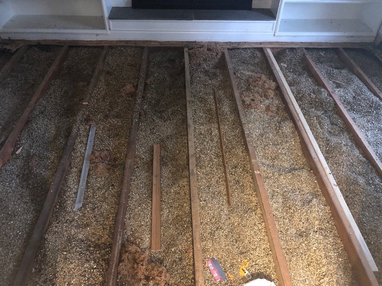 Exposed floor joists during subfloor reinforcement in Lake Forest, IL by Midwest Hardwood Floors