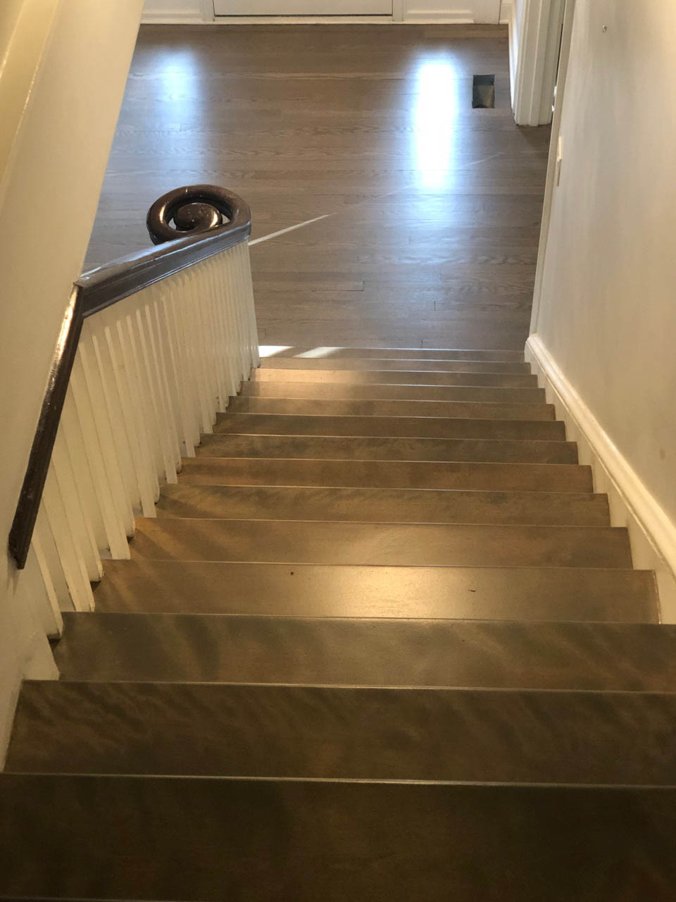 Red oak entry stairs during hardwood floor refinishing by Midwest Hardwood Floors