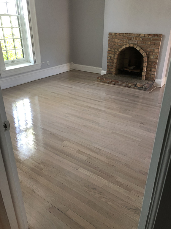 Finished white oak hardwood floor with Pickled Oak stain in Glencoe, IL by Midwest Hardwood Floors