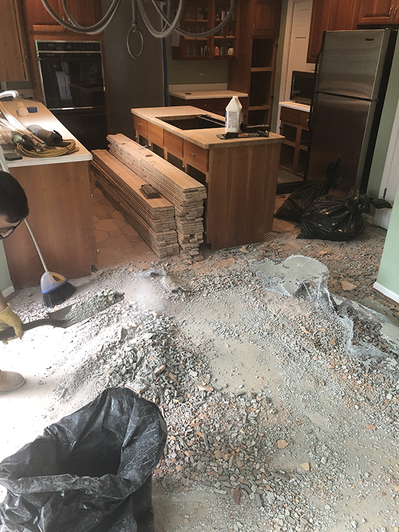 Ceramic tile floor removal for new hardwood flooring in Morton Grove, IL by Midwest Hardwood Floors