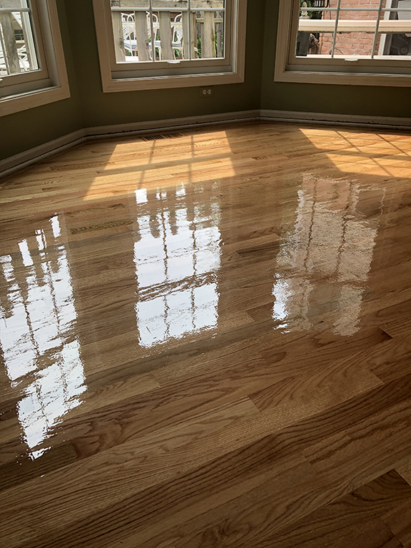 Finished hardwood flooring with natural stain in Morton Grove, IL by Midwest Hardwood Floors