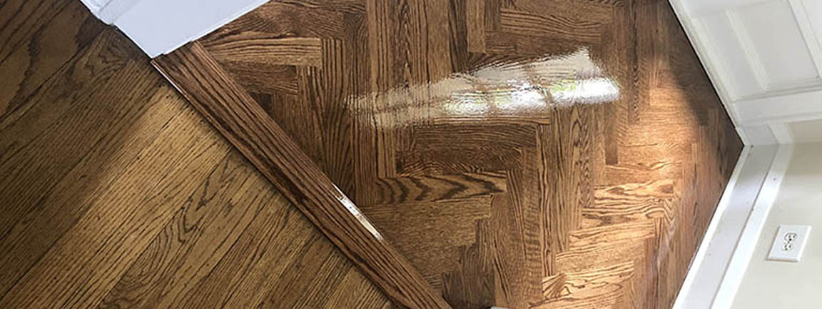 Finished herringbone entryway hardwood flooring in Glencoe, IL by Midwest Hardwood Floors
