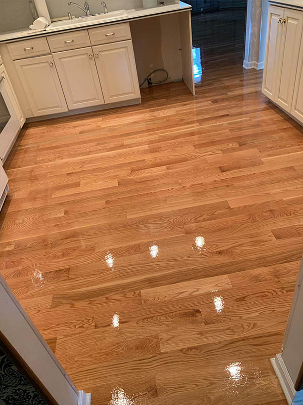 Finished white oak hardwood kitchen floor by Midwest Hardwood Floors