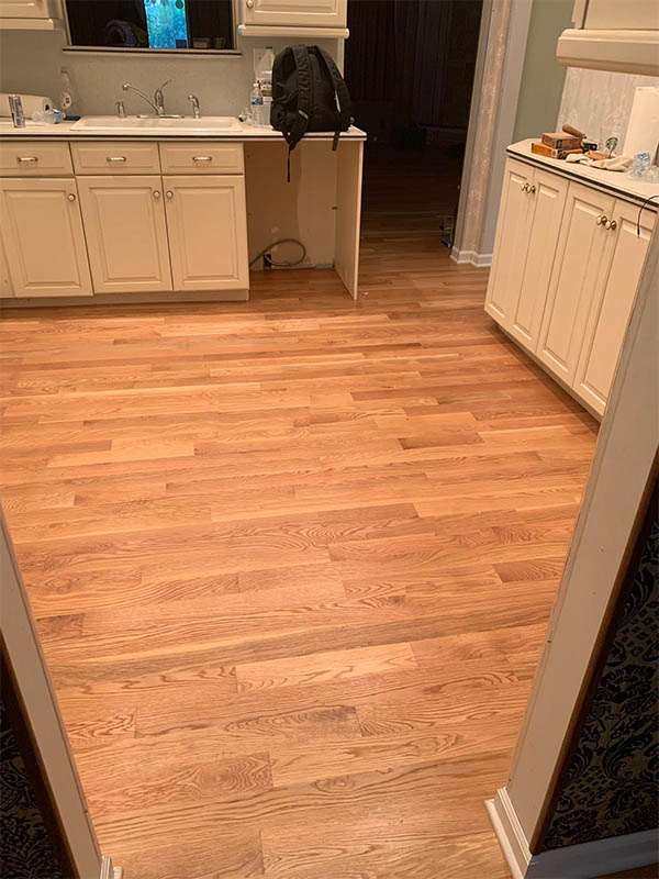White oak hardwood flooring installed in kitchen by Midwest Hardwood Floors