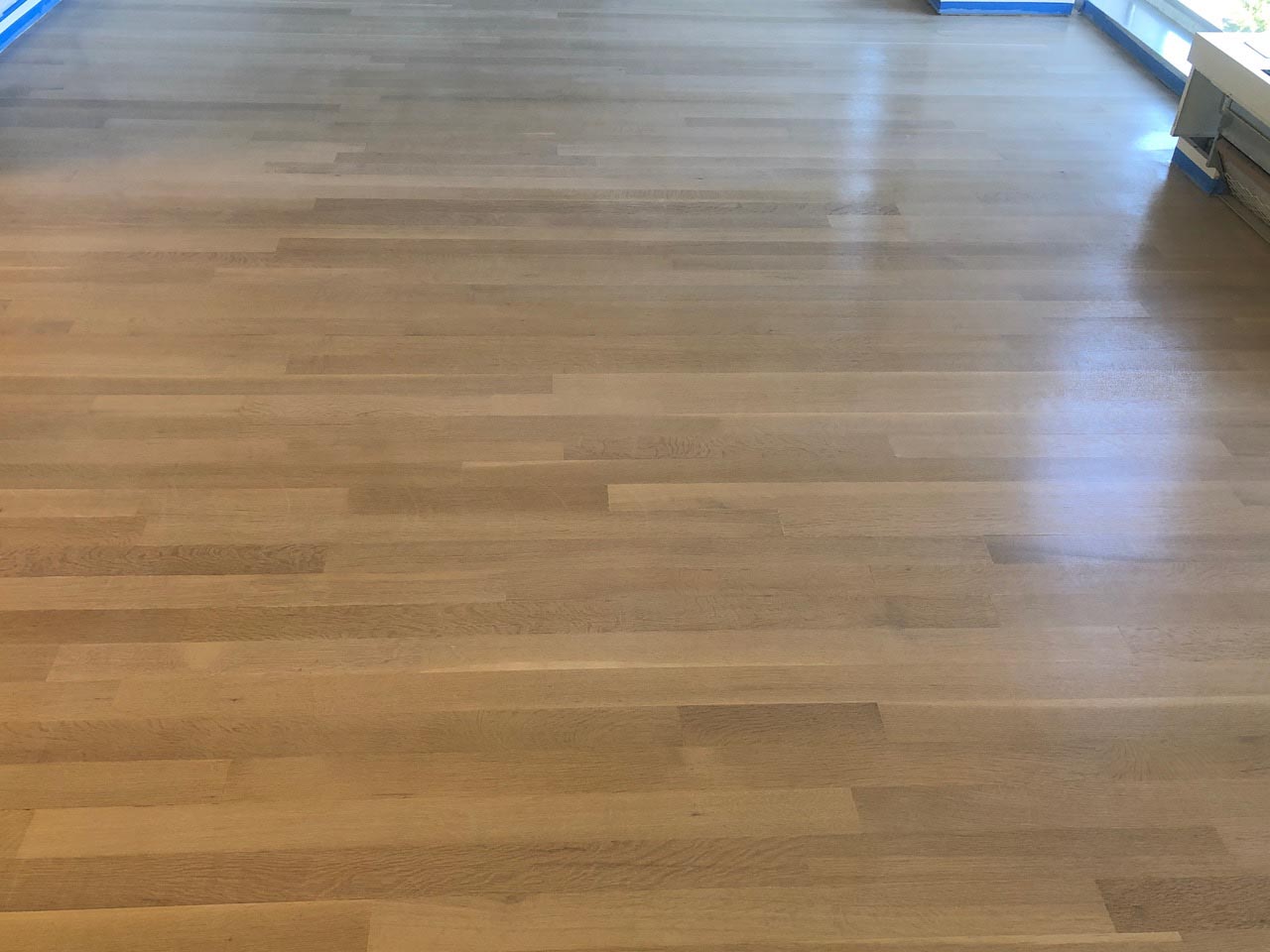 Completed Country White stained white oak hardwood floor by Midwest Hardwood Floors