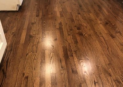Repaired subfloor and new hardwood throughout the kitchen