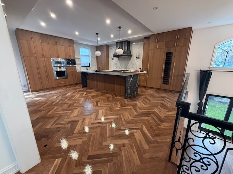 Custom herringbone hardwood flooring in a modern kitchen in Chicago
