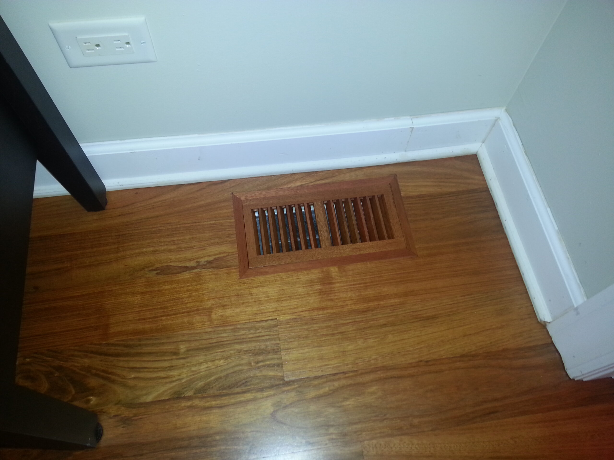 Brazilian Cherry hardwood flooring with matching wood floor vent in Lake Forest, IL by Midwest Hardwood Floors