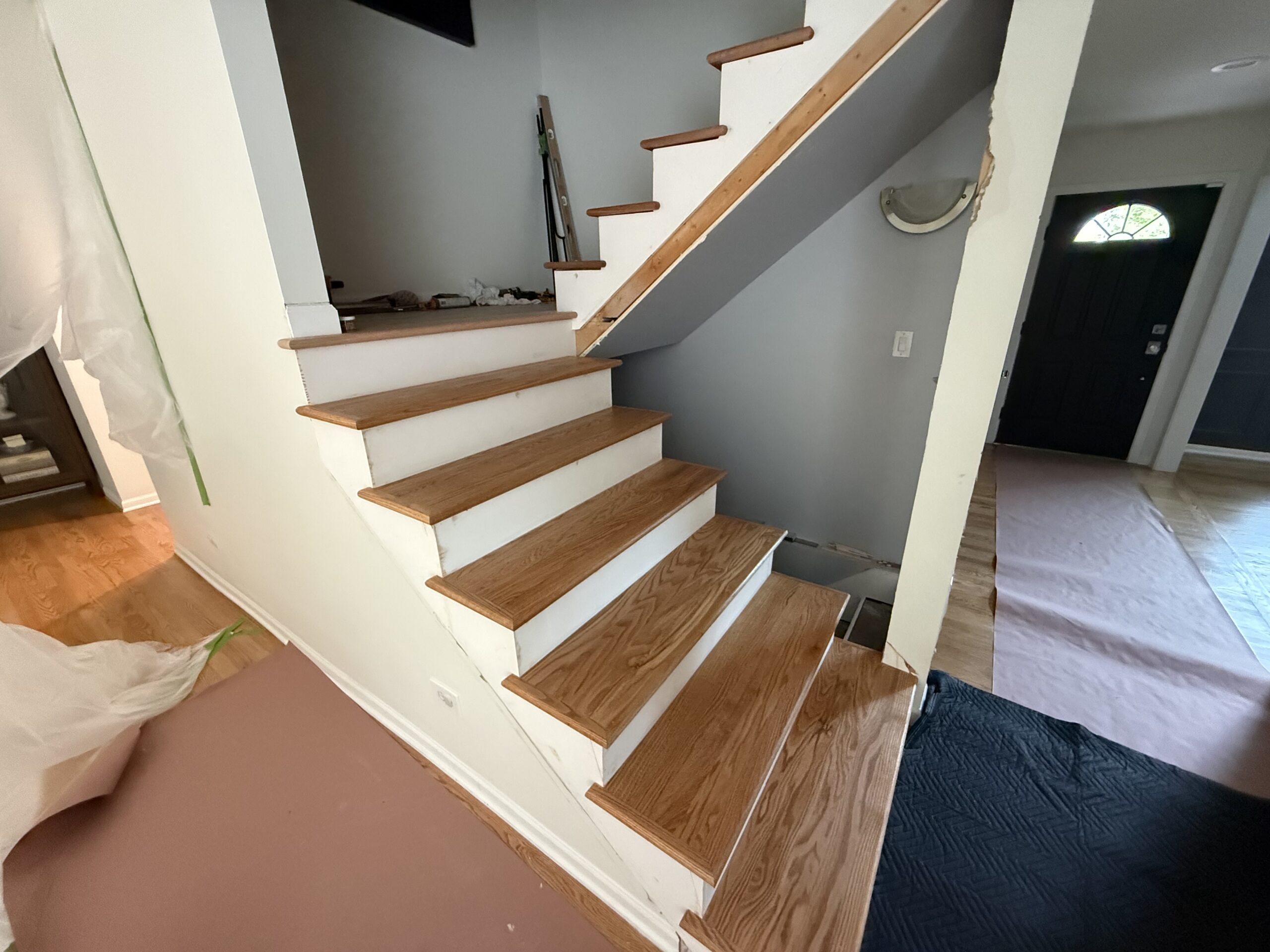Hardwood staircase with new oak treads installed by Midwest Hardwood Floors in a Highland Park home
