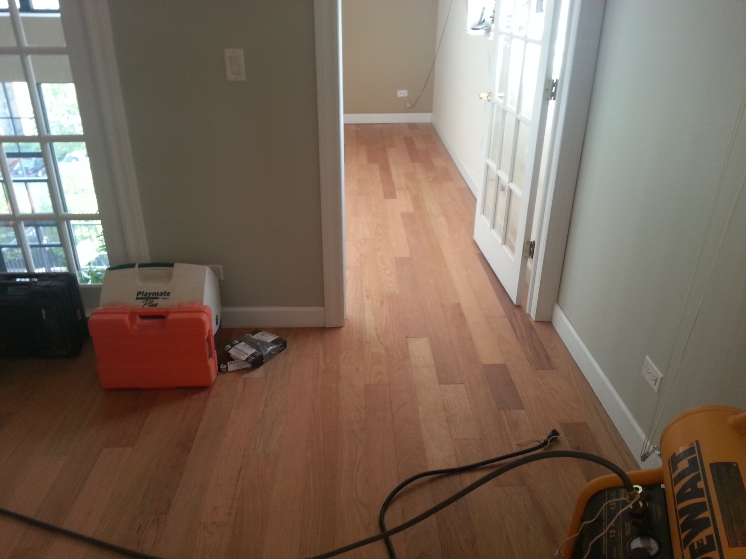 Unfinished Brazilian Cherry hardwood flooring before sanding and finishing in Lake Forest, IL by Midwest Hardwood Floors
