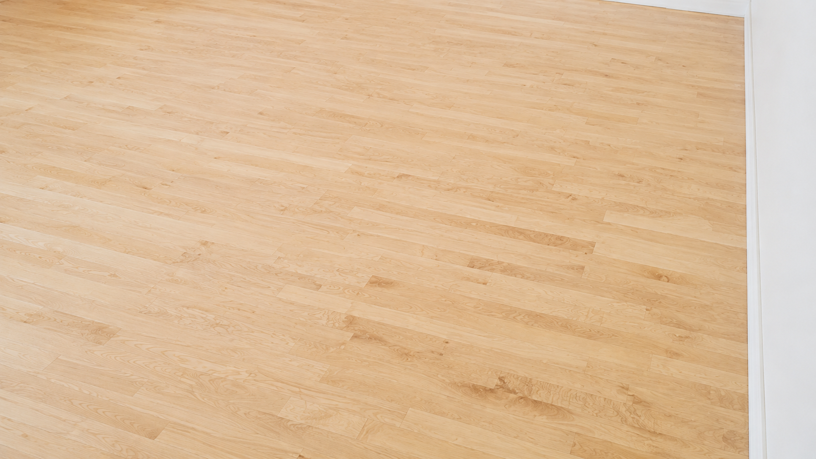 Unfinished maple hardwood floor before staining in Chicago, IL by Midwest Hardwood Floors