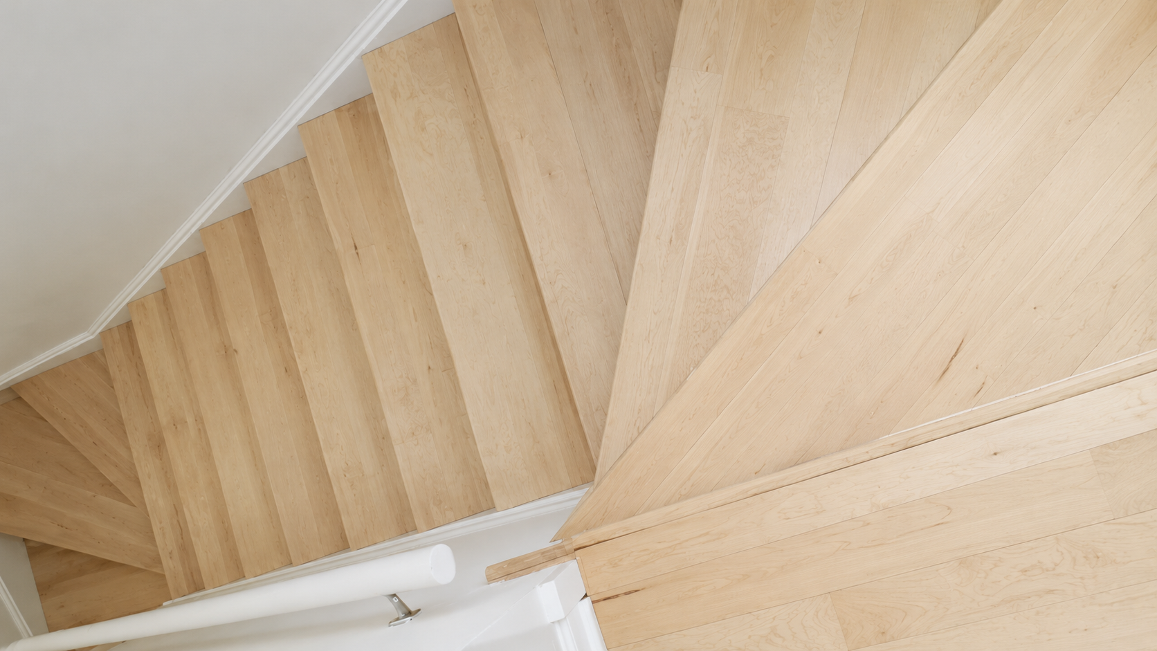 Unfinished maple hardwood stairs and landing in Chicago, IL by Midwest Hardwood Floors