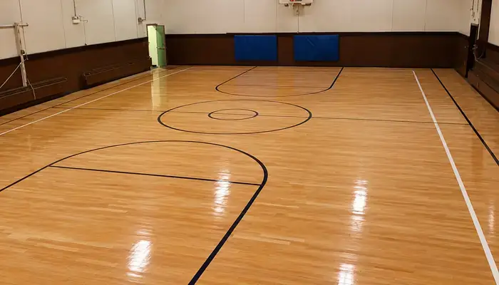 Refinished gym hardwood floor in Chicago, IL by Midwest Hardwood Floors