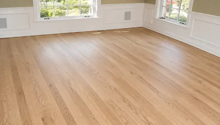 Unfinished oak hardwood floor during refinishing in Wilmette, IL